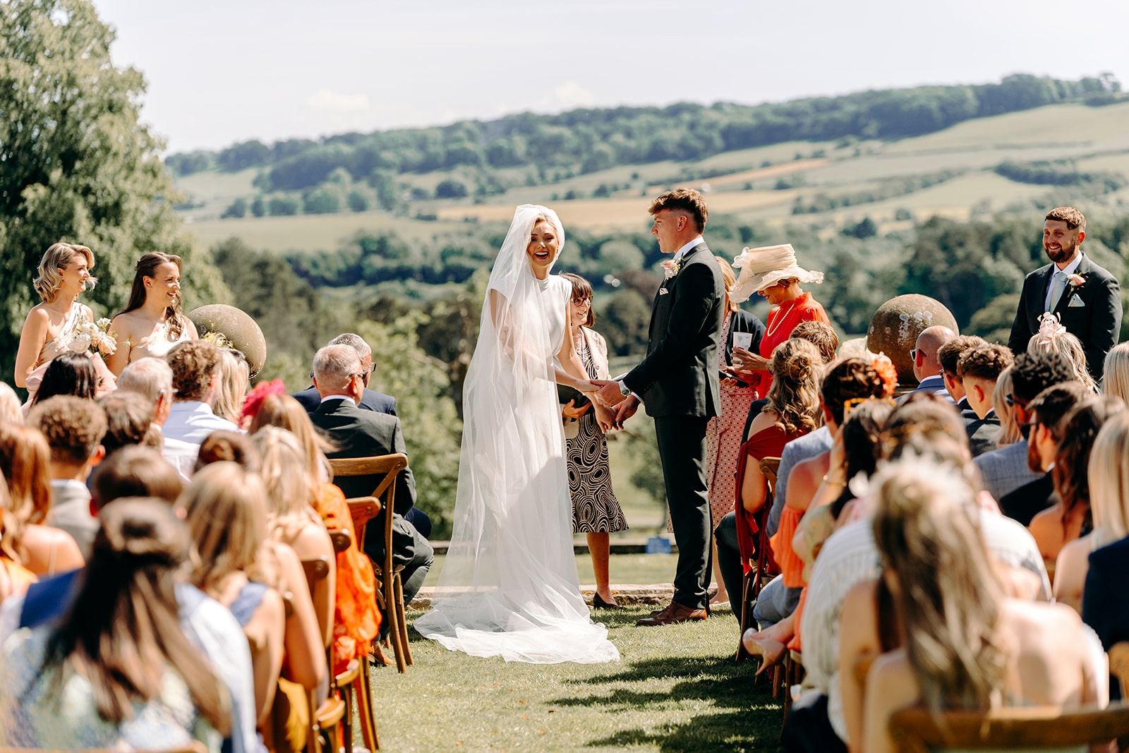 Thornbridge Hall outdoor wedding ceremony overlooking the rolling Derbyshire and Peak District countryside.