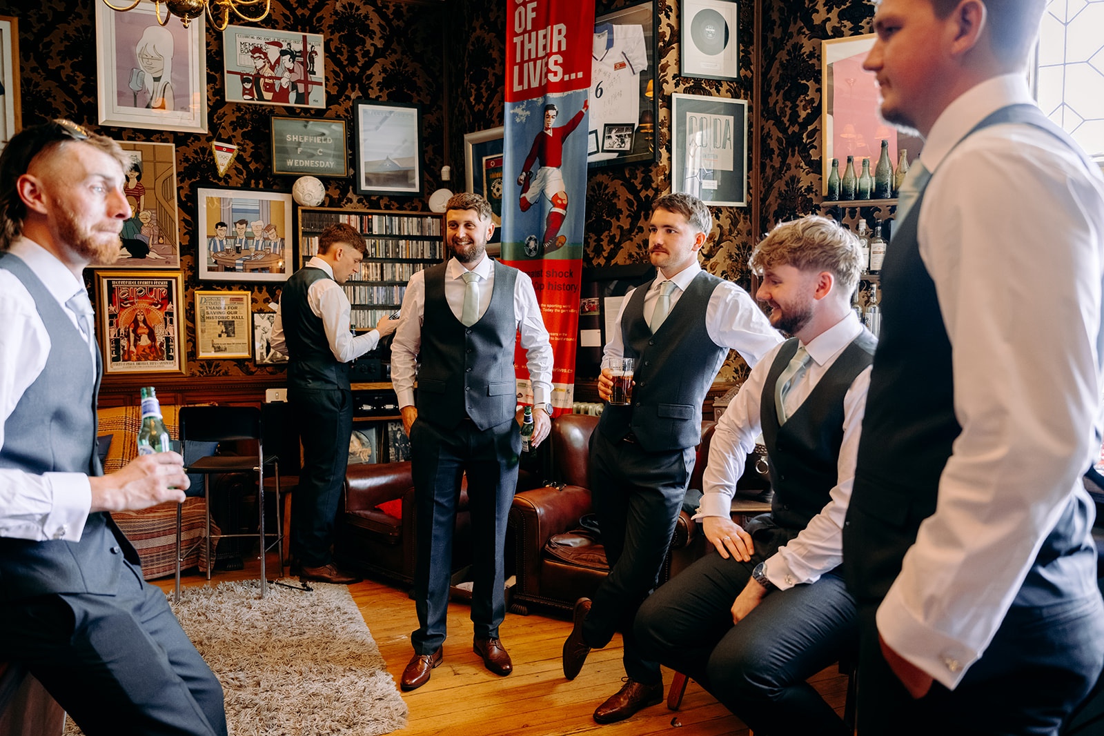 Groom and groomsmen relaxing together during the morning of a Thornbridge Hall wedding.